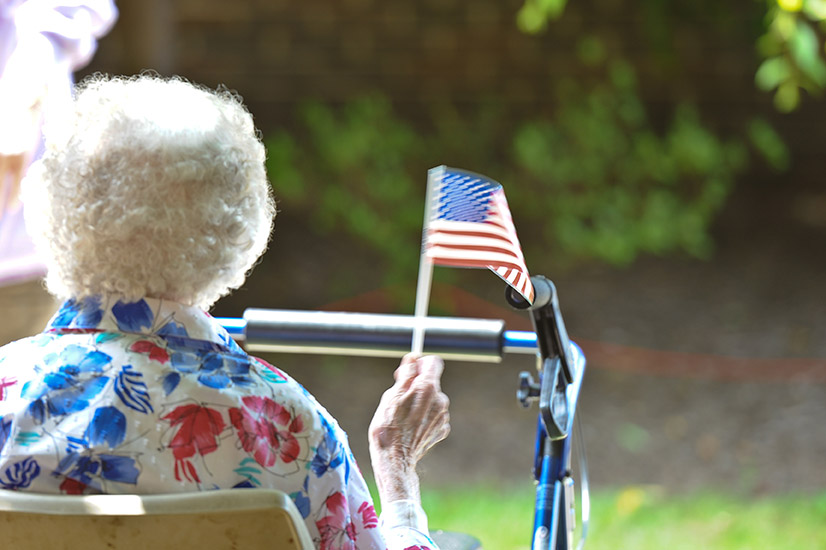 Woman holding american flag